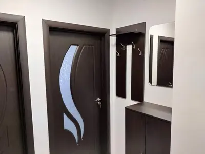 a bathroom with two doors and a mirror at Apartment Anelia 3 in Plovdiv