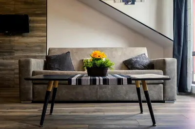 a coffee table in a living room with a couch at Urban Music Studio byPMM in Plovdiv