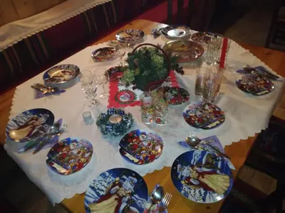 a table with plates of food on a table at Hotel Rai in Koprivshtitsa