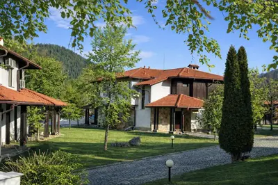 a house in the mountains with a gravel driveway at Марковската къща in Oreshak