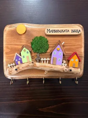 a wooden tray with houses on it on a table at Марковската къща in Oreshak