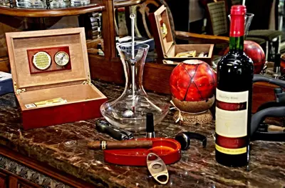 a table with a bottle of wine and a bottle at Villa Vuchev in Velingrad
