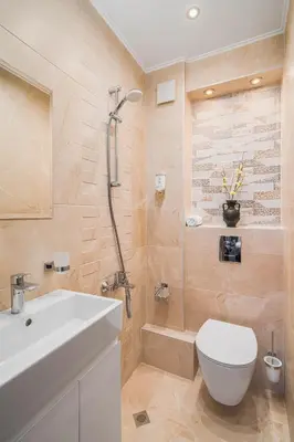 a bathroom with a shower and a toilet and a sink at АРТ СТУДИО СОФИЯ in Sofia