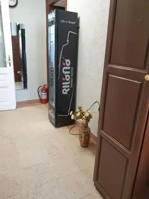 a large soda box sitting next to a door at KM!Sofia - Стаи за гости in Sofia