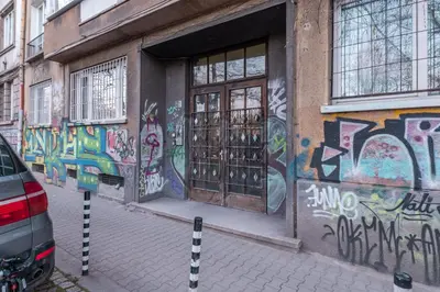 a building with graffiti on the side of it at Industrial 2-BDR Flat by the National Stadium by Flat Mаnager in Sofia