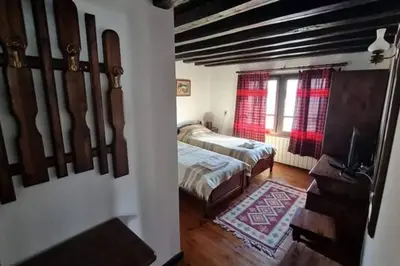a bedroom with two beds and a window at Guest House 
