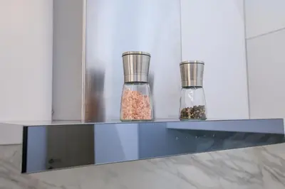 two glass jars filled with food sitting on a shelf at Лукс Апартамент Радост 2 in Sandanski