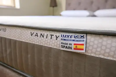 a mattress with a warranty sign on it at Feel at Home in Sandanski