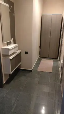 a bathroom with a sink and a mirror at Къща за гости Роял in Sandanski
