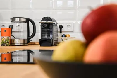 a coffee maker sitting on a kitchen counter next to a counter top at GUESTHOUSE MARIA / КЪЩА ЗА ГОСТИ МАРИЯ / GÄSTEHAUS MARIA in Karlovo