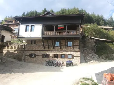 a building with bikes parked in front of it at Къща Стара Македония in Gostun
