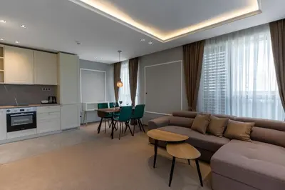 a living room with a couch and a table at City Park Inn in Plovdiv