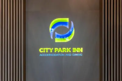 a city park im sign on a wall at City Park Inn in Plovdiv