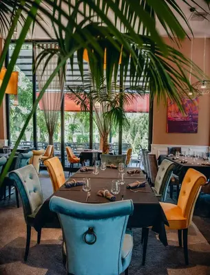 a dining room with a table and chairs at City Park Inn in Plovdiv