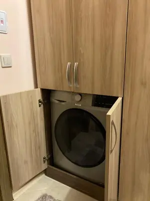 a microwave in a cabinet in a kitchen at Mirabell Apartment Bansko - Mountain View & Fireplace in Bansko