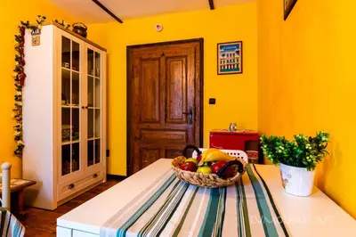 a basket of fruit on a table in a room at Art apartment EVMOLPIAS near Roman stadium in Plovdiv