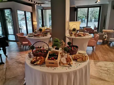 a table with food and baskets of food on it at The Five Elements Hotel and SPA in Sapareva Banya