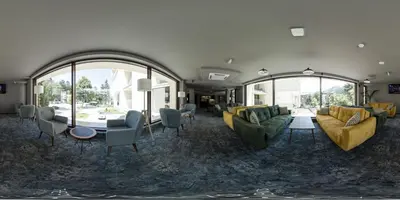 a living room with couches and a table and chairs at The Five Elements Hotel and SPA in Sapareva Banya