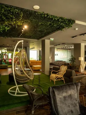 a living room with chairs and a swing at The Five Elements Hotel and SPA in Sapareva Banya
