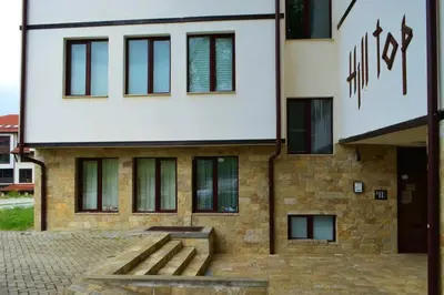a building with a bench in front of it at Cozy studio in 