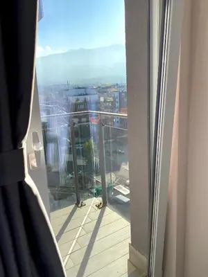 a view of a balcony with a view of a city at Mountain View Magenta White apartment in Sofia