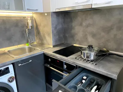 a kitchen with a stove and a pot on the stove at Mountain View Magenta White apartment in Sofia