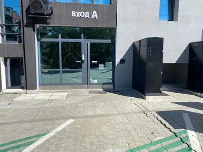 an entrance to a building with a glass door at Mountain View Magenta White apartment in Sofia