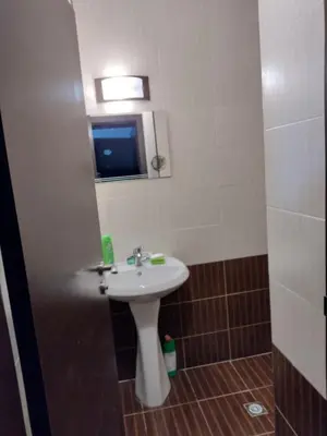 a bathroom with a sink and a mirror at Apartment BanskoIN in Bansko