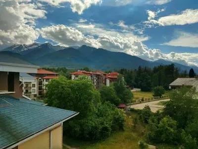 a view of a town with mountains in the background at Apartment BanskoIN in Bansko