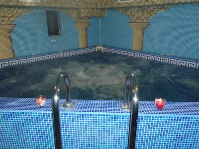 a large swimming pool with candles in it at BULGARI melnik in Melnik