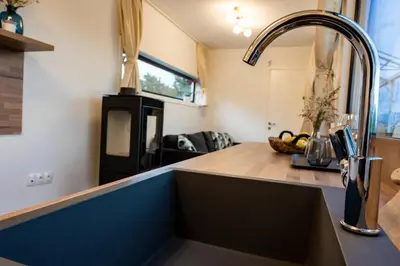 a kitchen with a sink in a tiny house at HomeRevolution in Marikostinovo