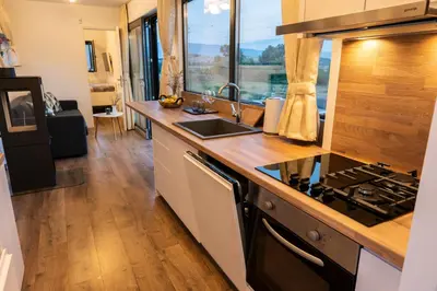 a kitchen with a sink and a stove top oven at HomeRevolution in Marikostinovo