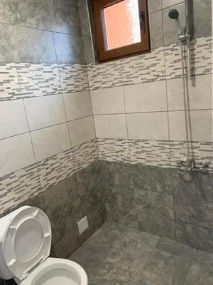 a bathroom with a toilet and a shower at Къщи за гости “Планински Рай” Mountain Paradise in Resilovo