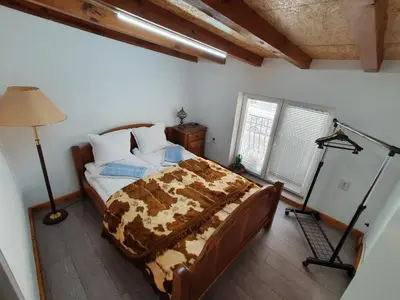 a bedroom with a bed and a lamp in it at Modern and Old LODGE in Sofia