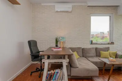 a living room with a couch and a table at 2BD Flamingo Flat with Balcony in Sofia Center by Flat Mаnager in Sofia