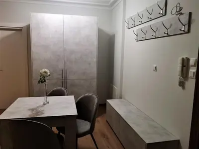 a dining room with a table and two chairs and a table sidx sidx at Sofia hotel apartments in Sofia