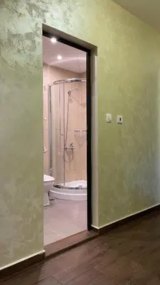 a bathroom with a shower and a toilet at Thea Apart in Sandanski