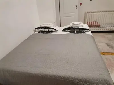a bed in a room with two mattresses at Brand New Apartment in Sofia