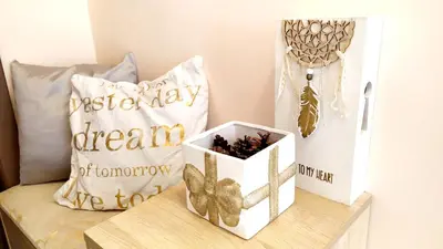 a table with a box of chocolates and a pillow at Lovely City Center 1BD, 1BT Apartment in Sofia