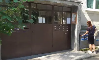 a woman standing in front of a garage door at Lovely City Center 1BD, 1BT Apartment in Sofia