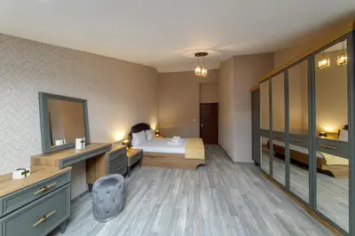 a hotel room with a bed and a bathroom at Luxury 2-bedroom apartment by Studenets Center by Flat Mаnager in Pamporovo