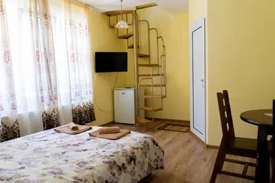 a bedroom with a bed and a book shelf at Къща Лиляна in Resilovo