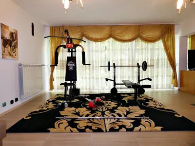 a room with a gym with a rug on the floor at Grande - Velingrad in Velingrad