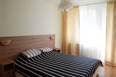 a bedroom with a bed with two pillows on it at Cozy One Bedroom Apartment in Iglika Complex in Borovets