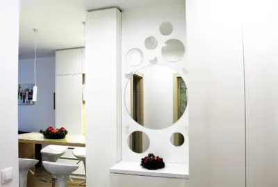 a bathroom with a mirror on the wall at Borovets Gardens Luxury apartment E11 in Borovets