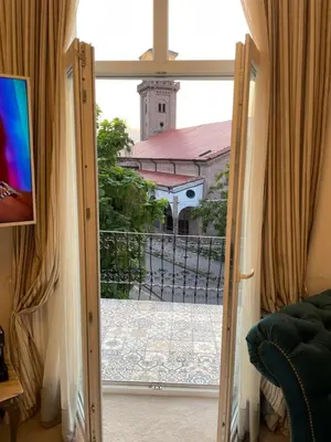 an open door with a view of a church at Villa al Tempio in Pazardzhik