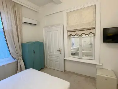 a bedroom with a window and a bed and a windowpectpect at Villa al Tempio in Pazardzhik