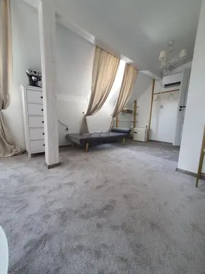 an empty room with a couch and a window at Villa al Tempio in Pazardzhik