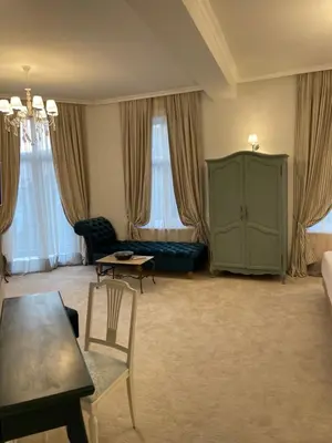 a living room with a green cabinet and a couch at Villa al Tempio in Pazardzhik