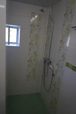 a bathroom with a shower with a shower curtain at Старата къща / село Тъжа in Tŭzha